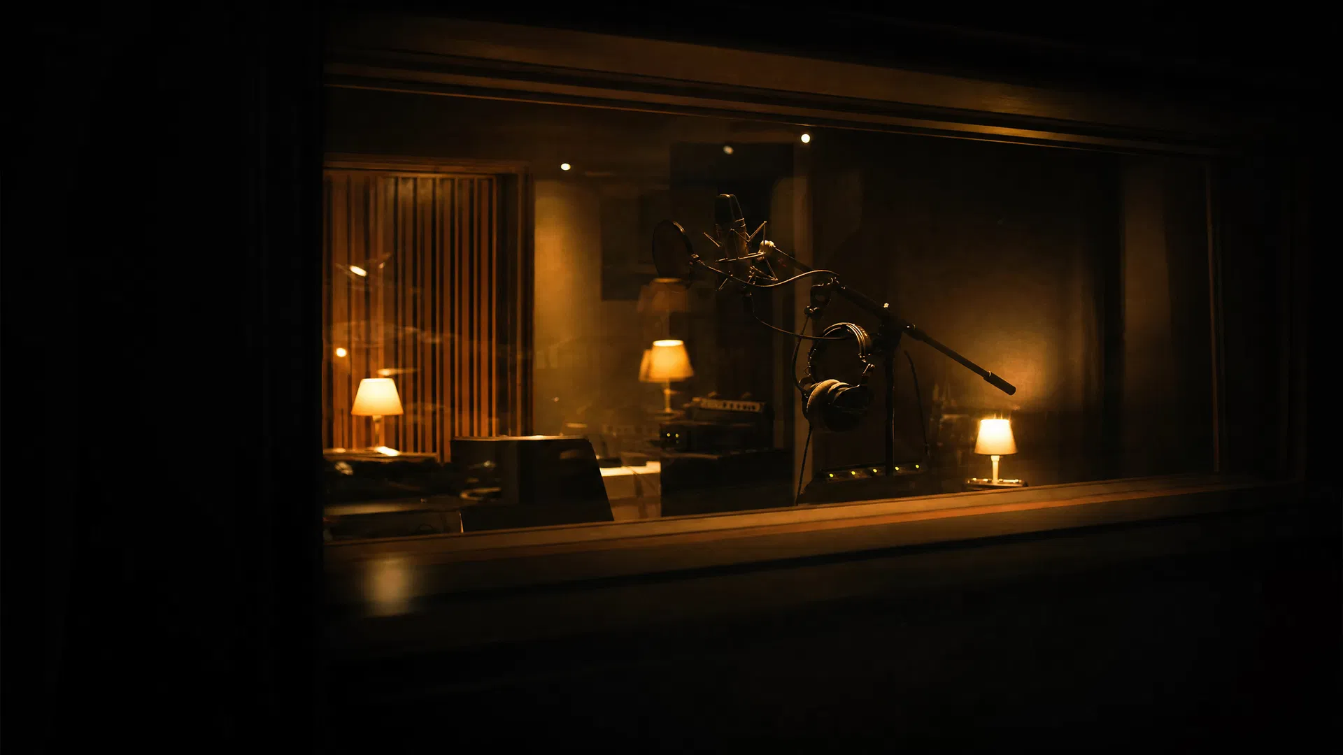 Recording studio at night with warm golden lighting