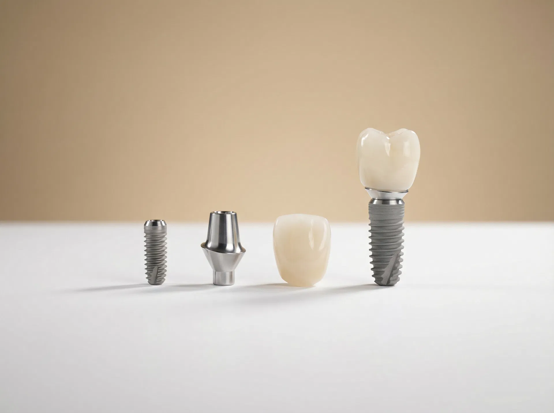 Straumann dental implant components — titanium screw, abutment, and porcelain crown — premium Swiss implants at Oakridge Park Dental Vancouver BC