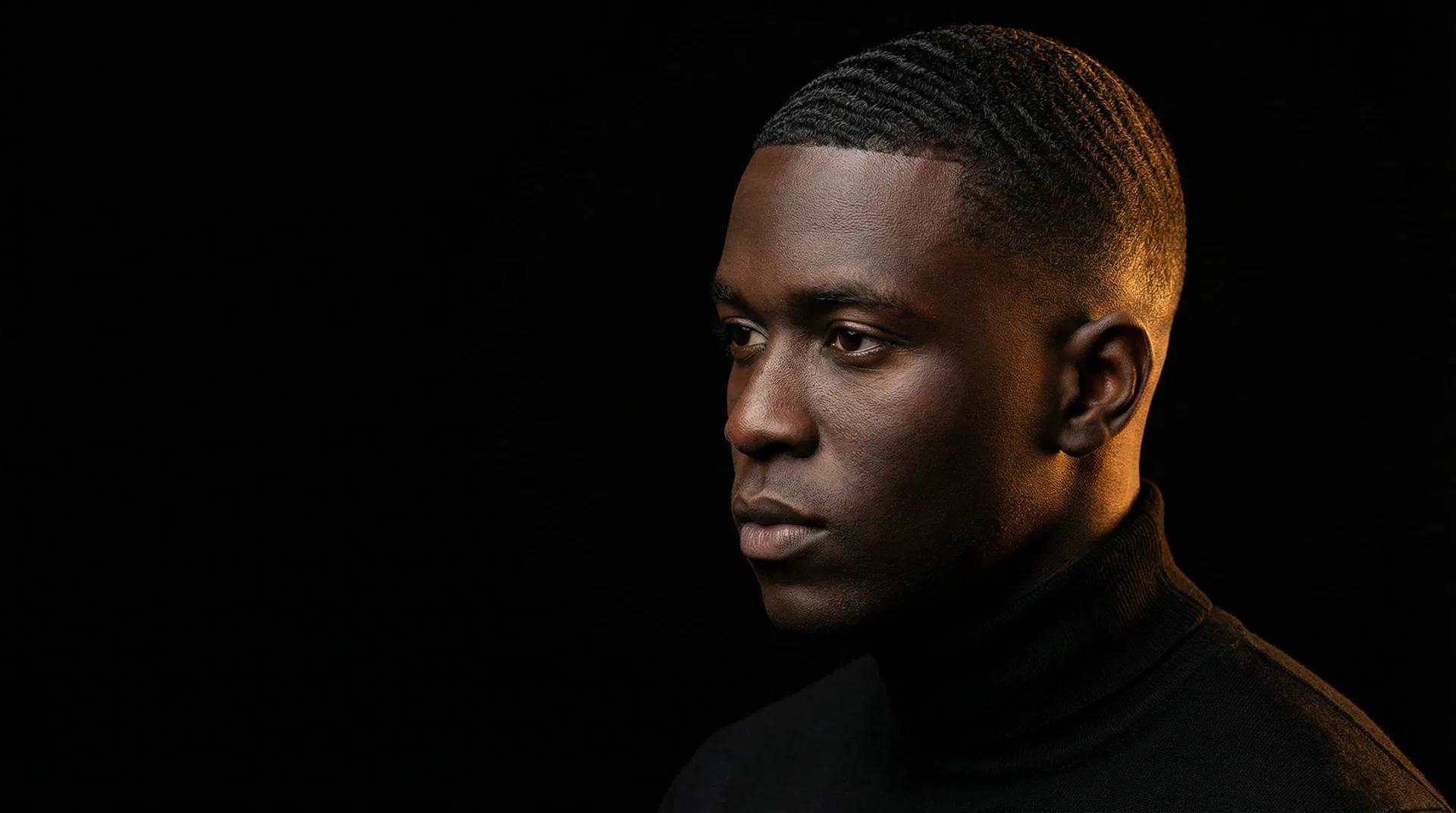 Black man with deep ebony skin and flawless 360 waves, crisp skin fade, wearing a black turtleneck — warm amber rim lighting illuminates the wave pattern, subject fills the frame
