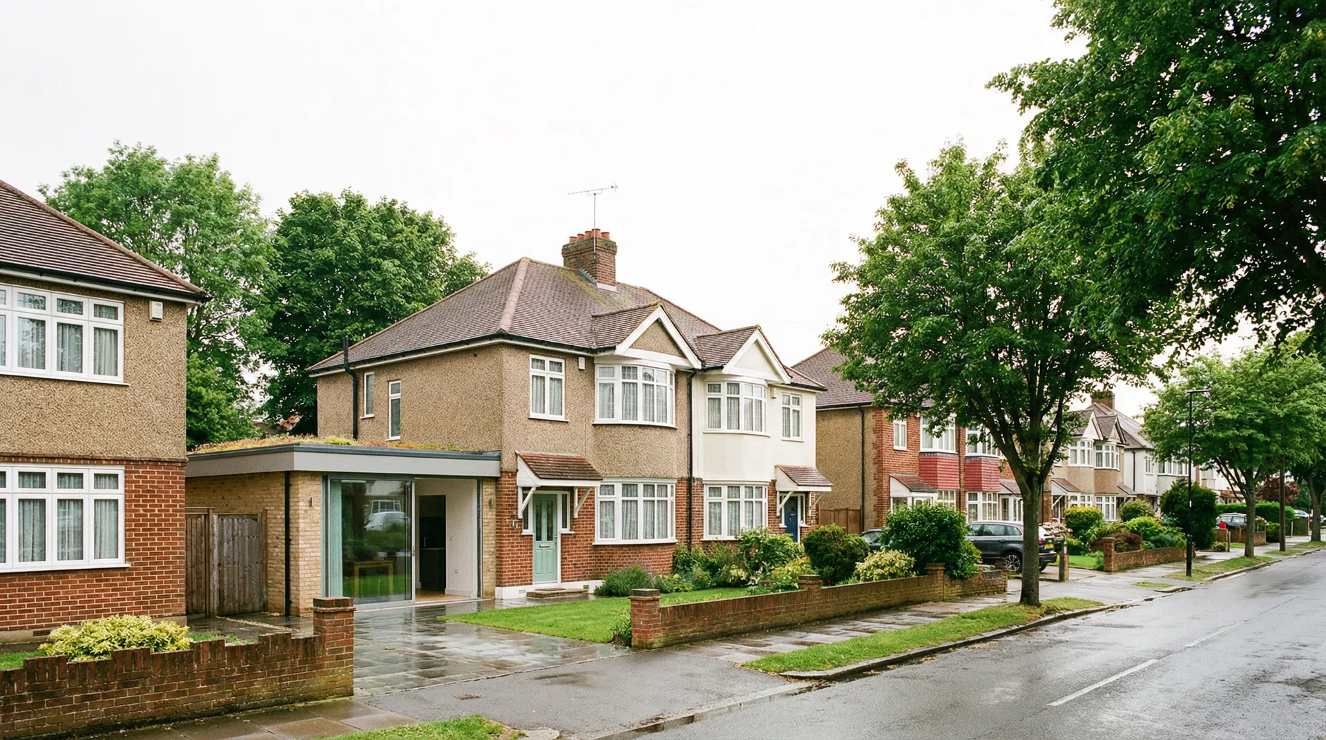 Borehamwood residential street with modern house extension and glazed doors