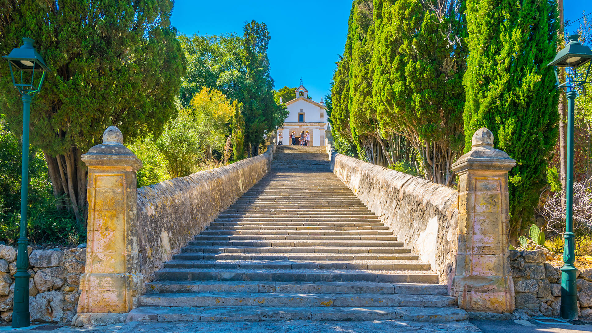 The 365 Calvari Steps in Santa Eulalia, Ibiza, leading up to the El Calvari chapel on a sunny day
