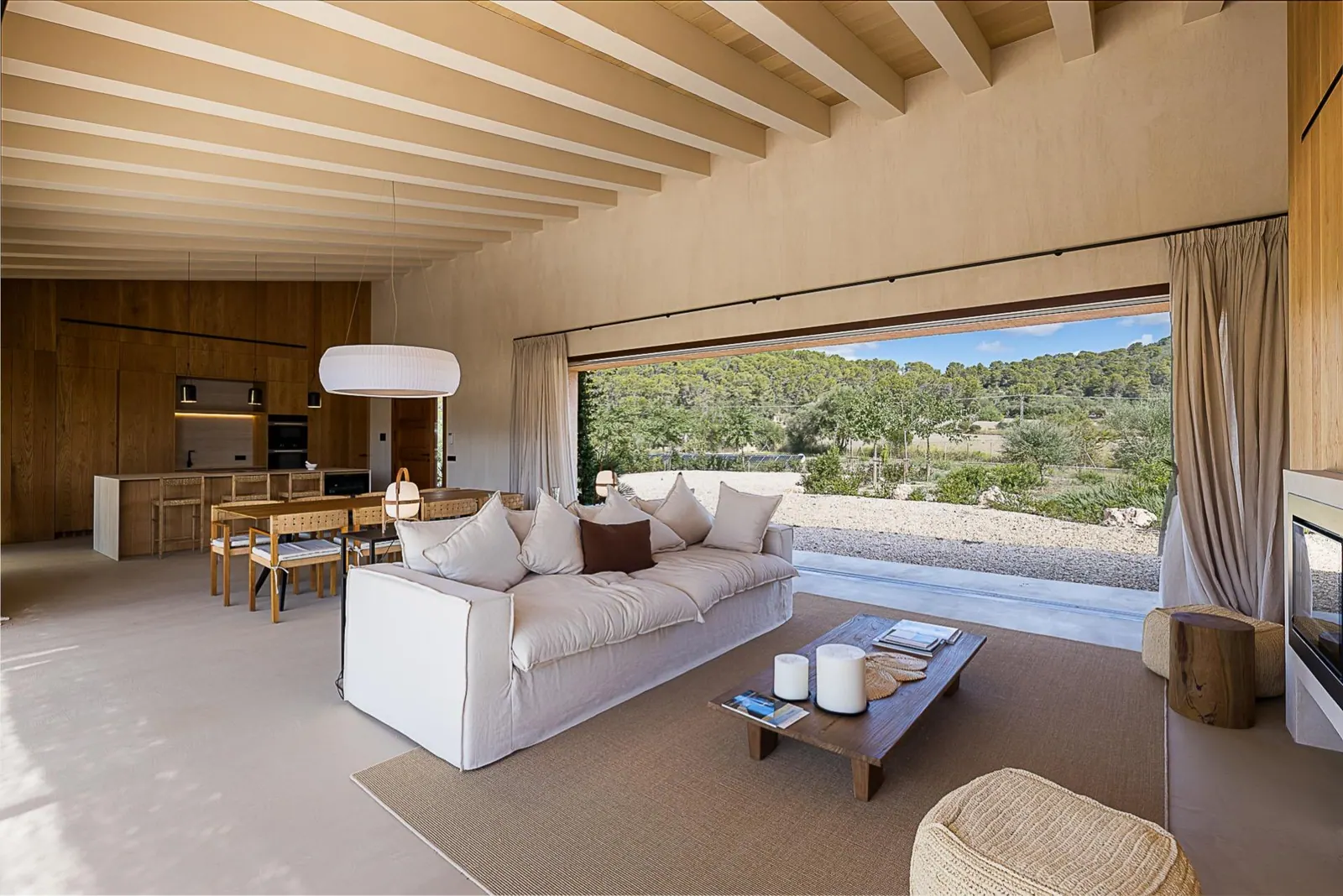 Open-plan living room with sliding doors to the countryside in Llucmajor