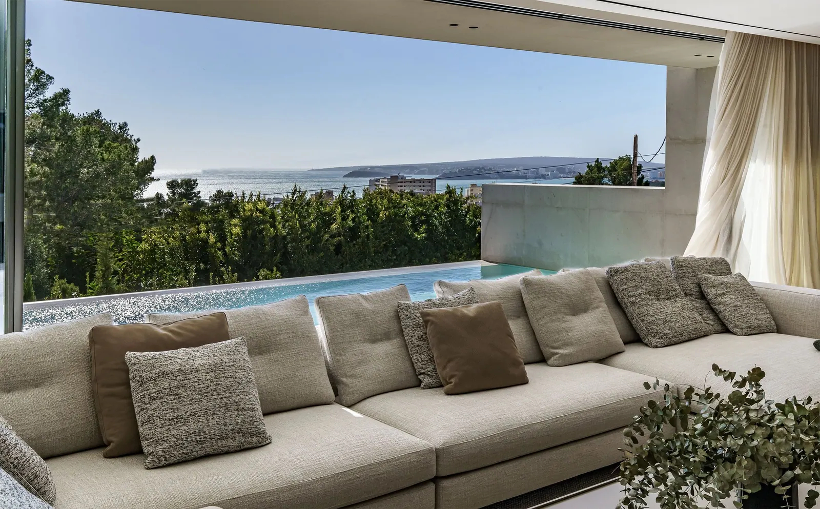 Living room of a villa in Portals Nous opening onto a terrace with sea views