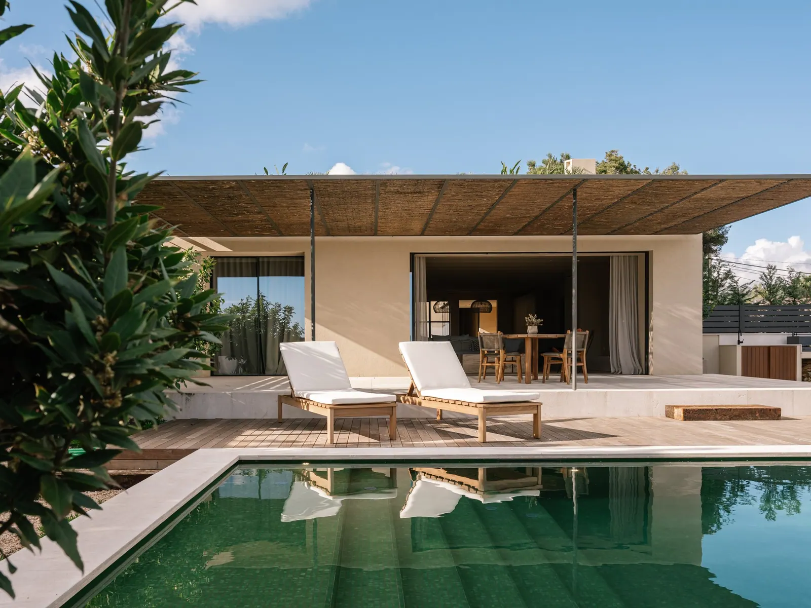 Pool and garden of a new villa in Establiments with views towards the sea