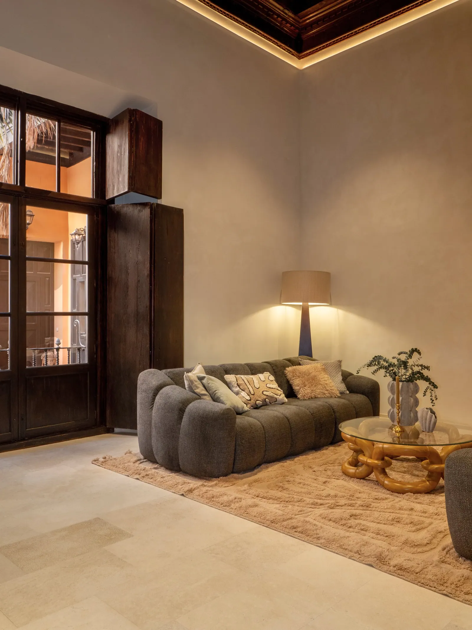 High-ceilinged living room with original timber beams in a sixteenth-century building in Palma's Old Town