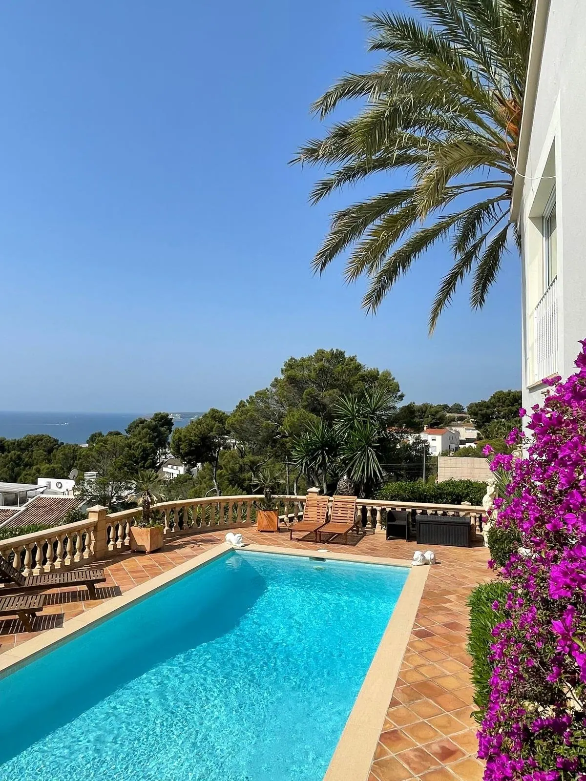 Pool terrace with sea views at a contemporary villa in Costa d'en Blanes