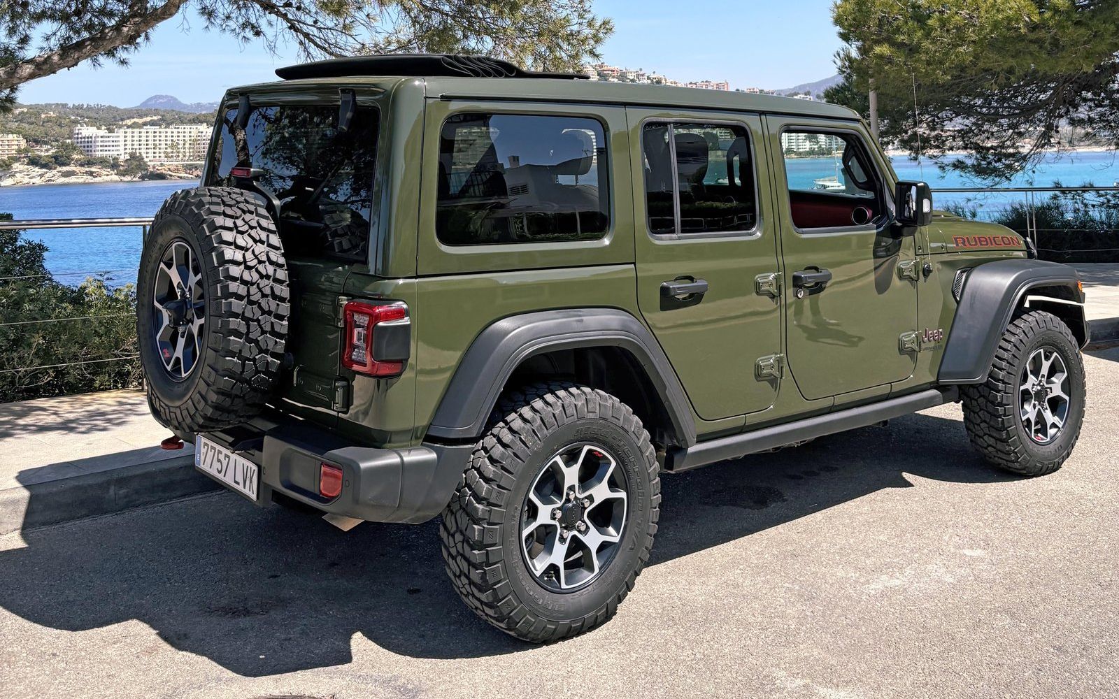 Green Jeep Wrangler Rubicon overlooking Santa Ponsa bay, Mallorca