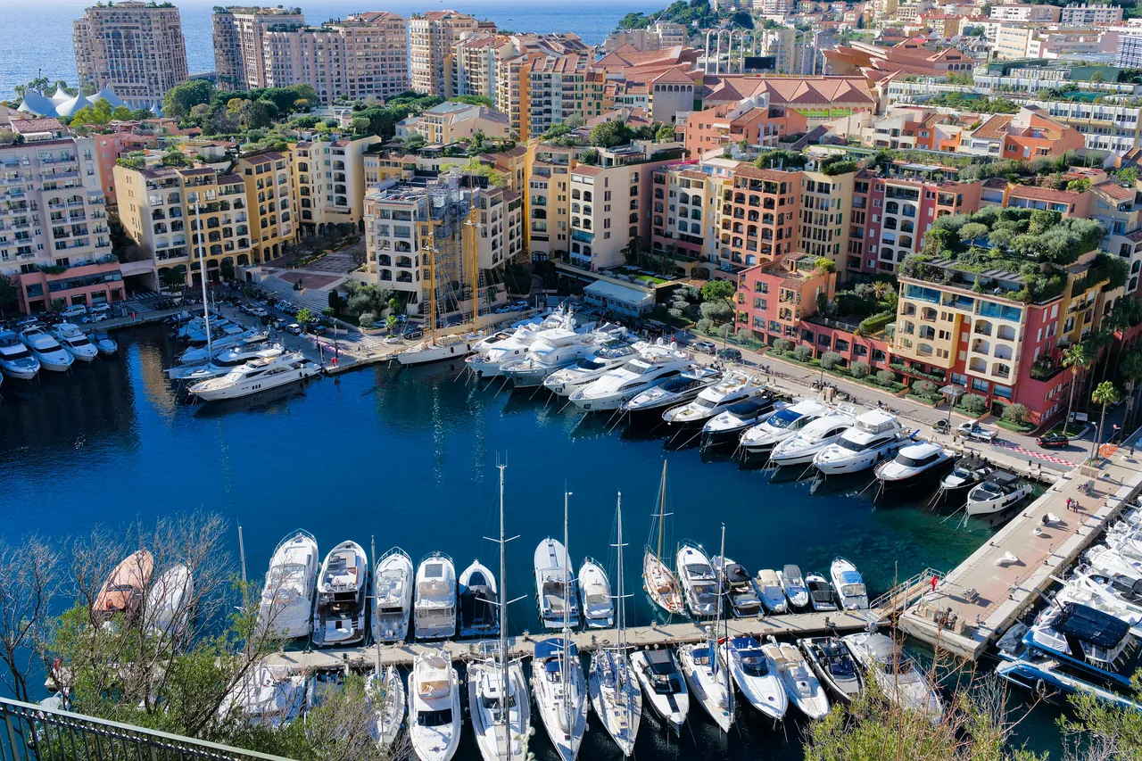 Aerial view of superyachts in Port Hercule, Monaco, beneath the Rock