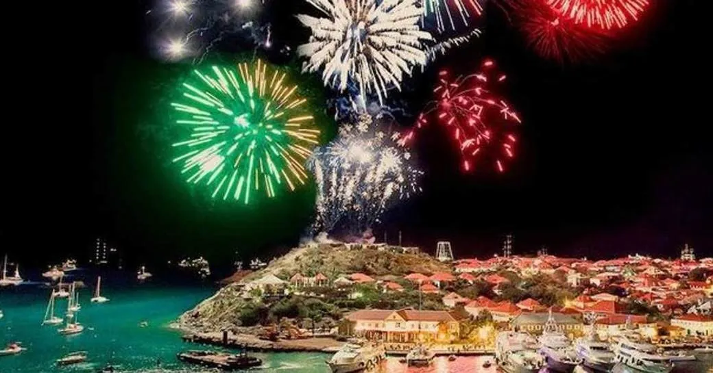Fireworks over St Barths harbour with superyachts on New Year's Eve