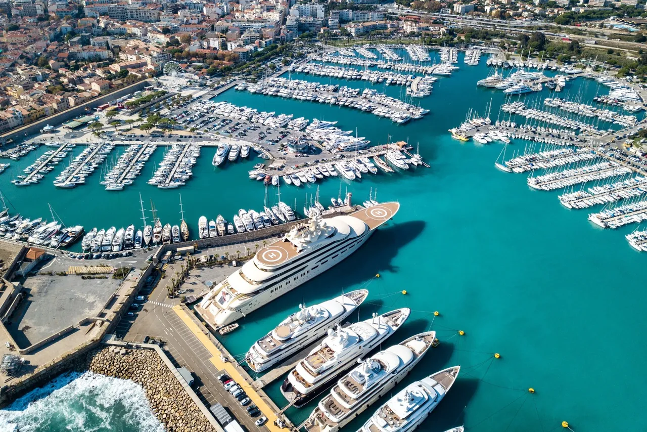 Aerial view of luxury superyachts docked at Port Vauban in Antibes, France.