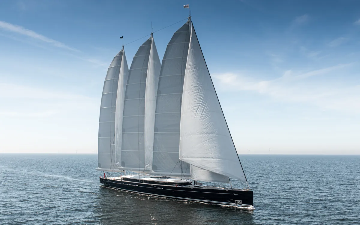 Aerial view of sailing yacht Black Pearl cruising in unidentified open waters.