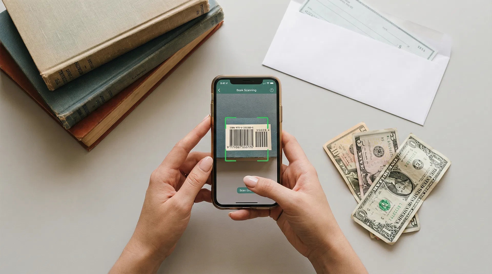 Person scanning book ISBN barcode with smartphone to get instant cash offer