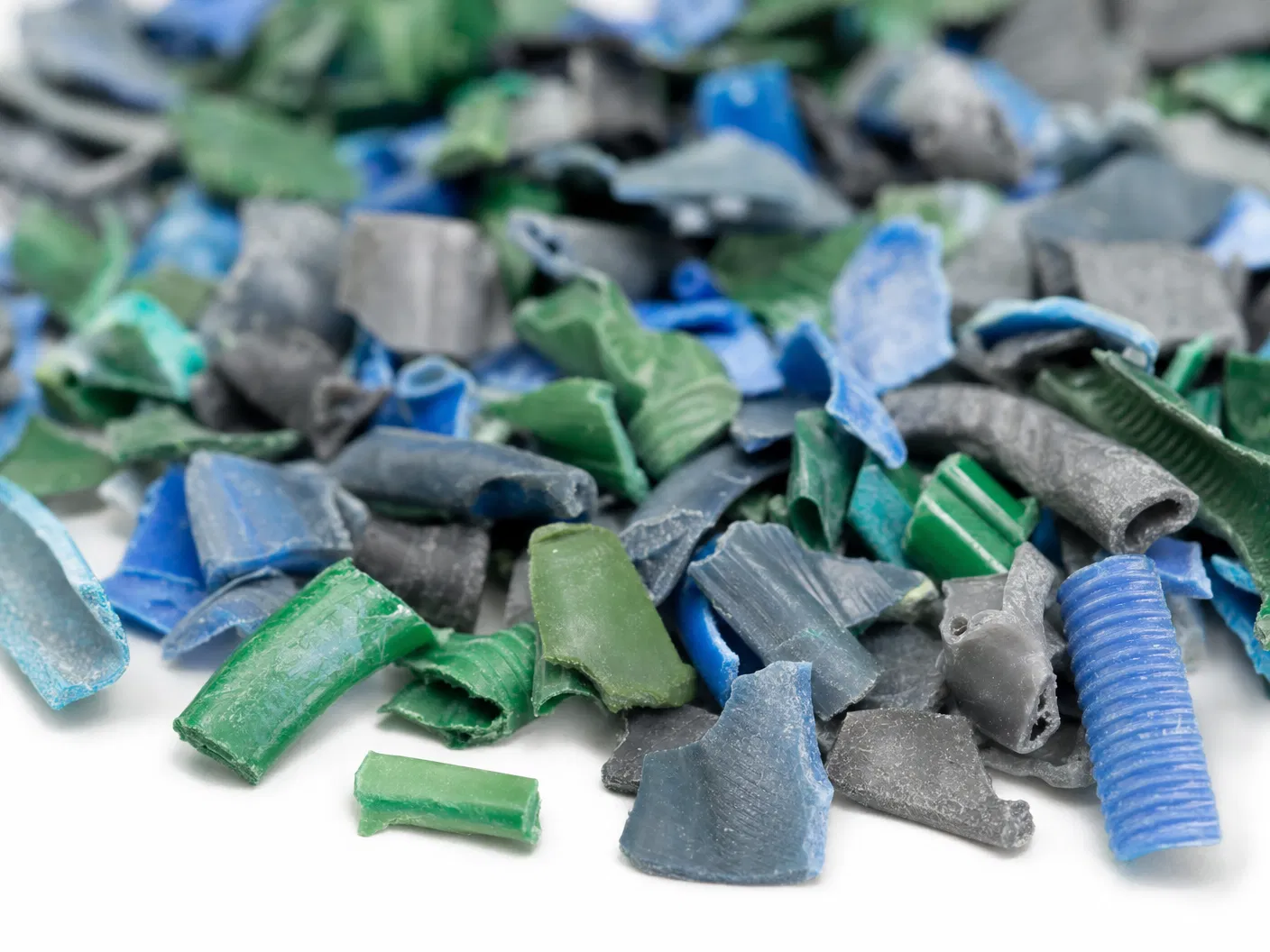 Shredded PVC fragments from recycled Egyptian garden hoses