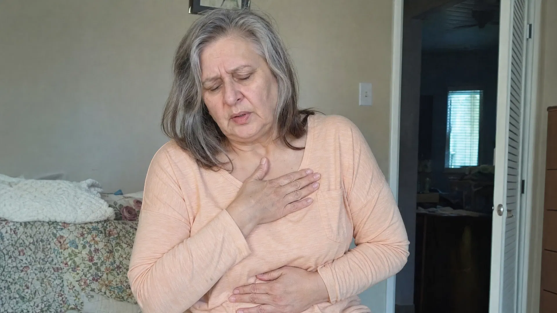 Older woman experiencing heartburn discomfort