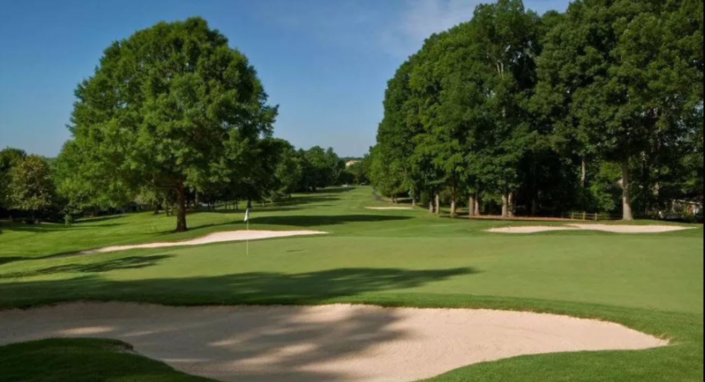 Overview of the 18th hole at Bermuda Run Country Club East Course with clubhouse in the background