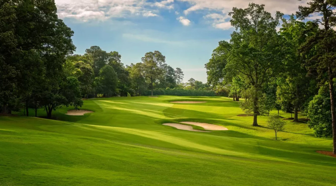 Aerial view of the iconic 18th hole at East Lake Golf Club with the clubhouse in the background