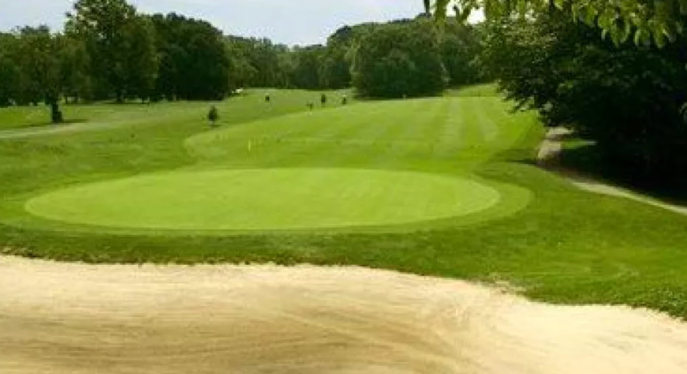 Scenic view of a tree-lined fairway at Forest Park Golf Course in Woodhaven, Queens