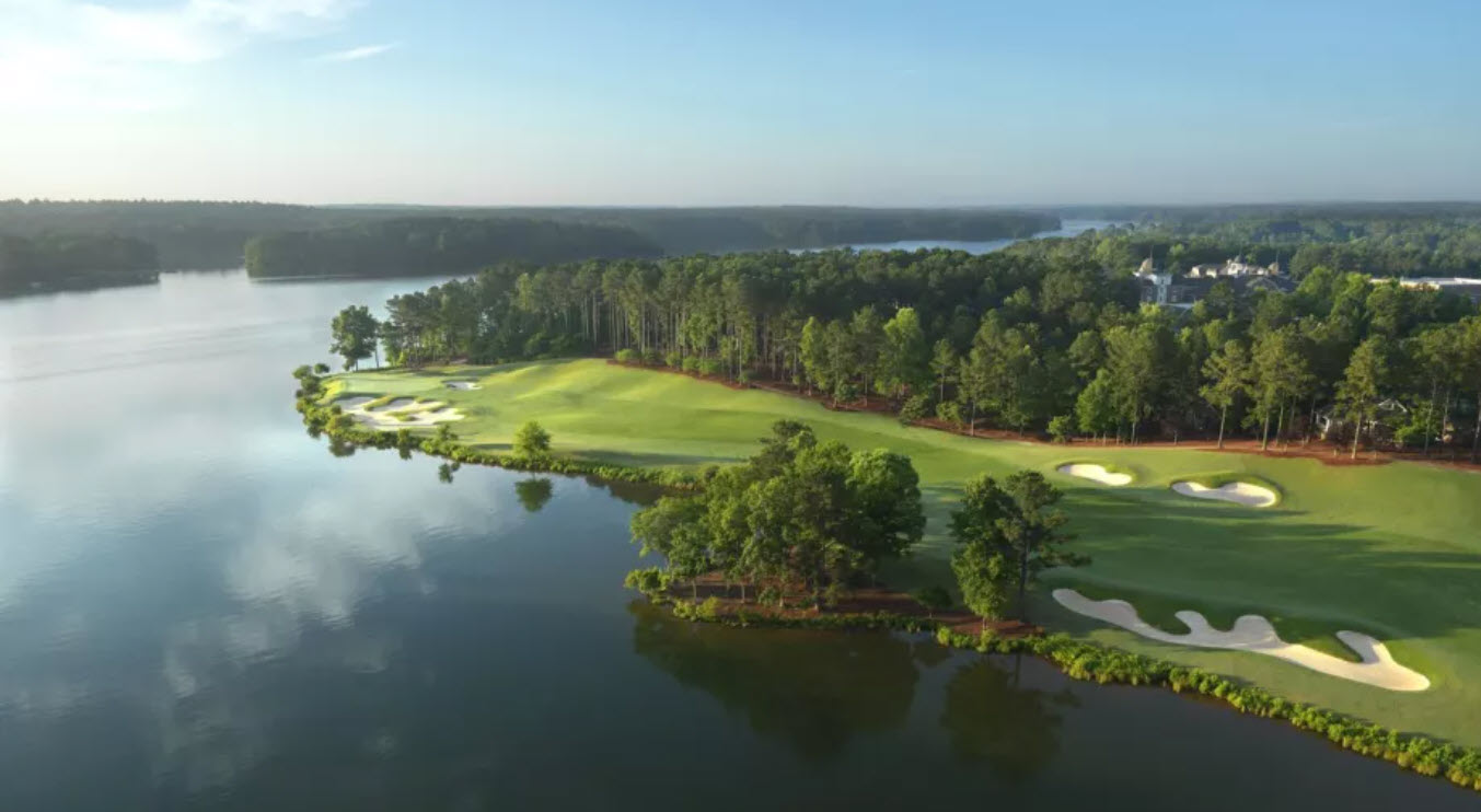 Panoramic view of the 18th hole at Reynolds Lake Oconee Oconee Course with clubhouse in background