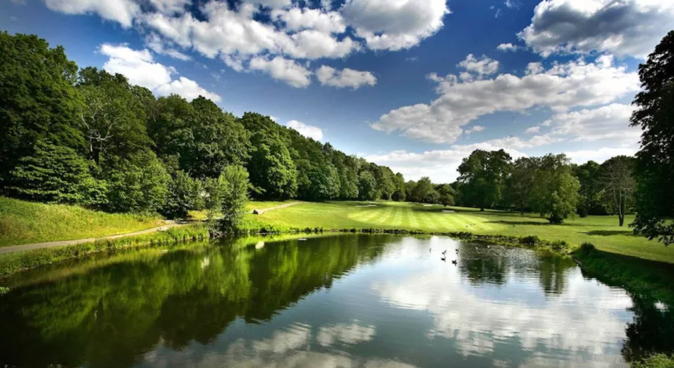 Aerial view of Van Cortlandt Park Golf Course with green fairways and mature trees