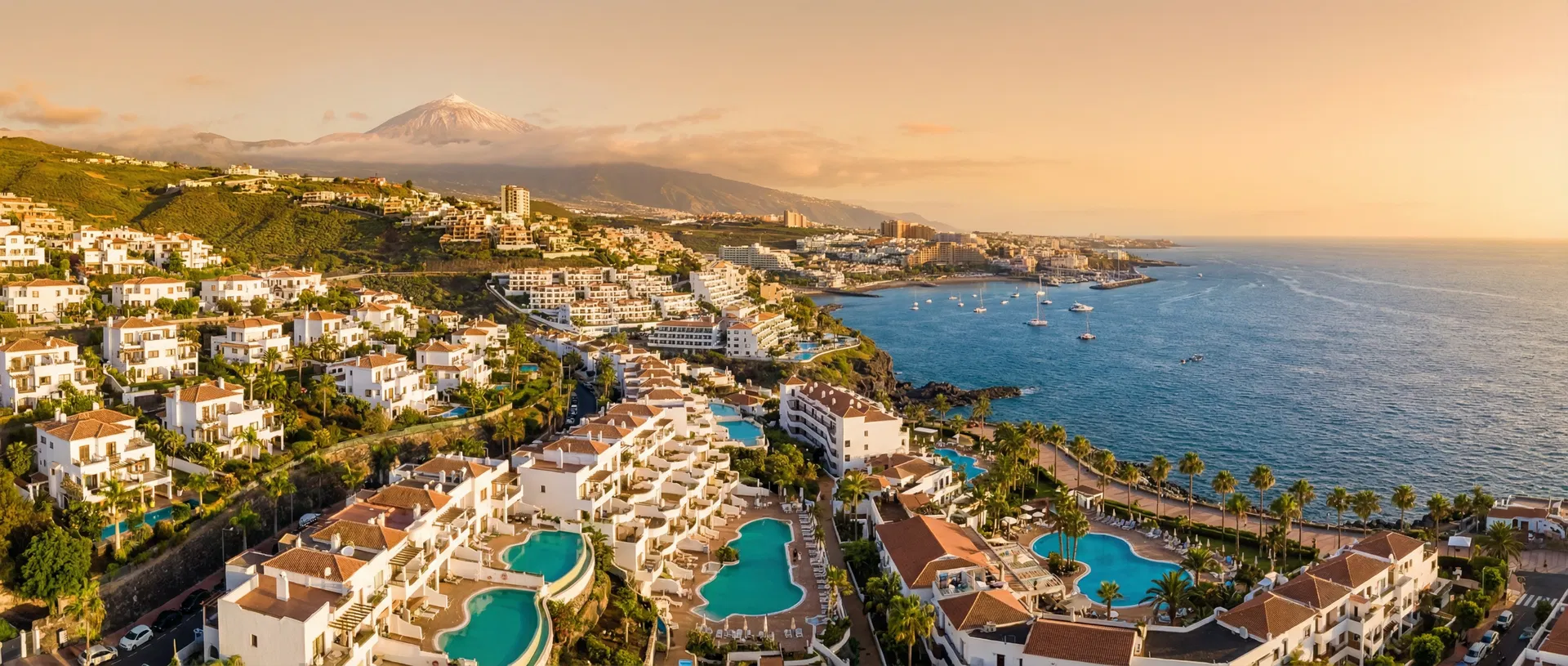 Aerial view of Tenerife south coast with turquoise ocean and Mount Teide - find trusted tradespeople in Tenerife