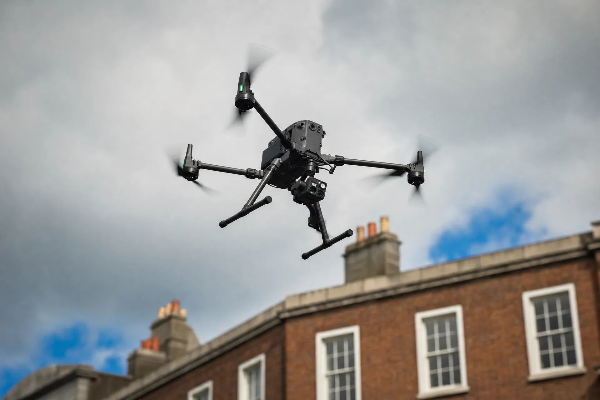 Professional drone in flight over Dublin building