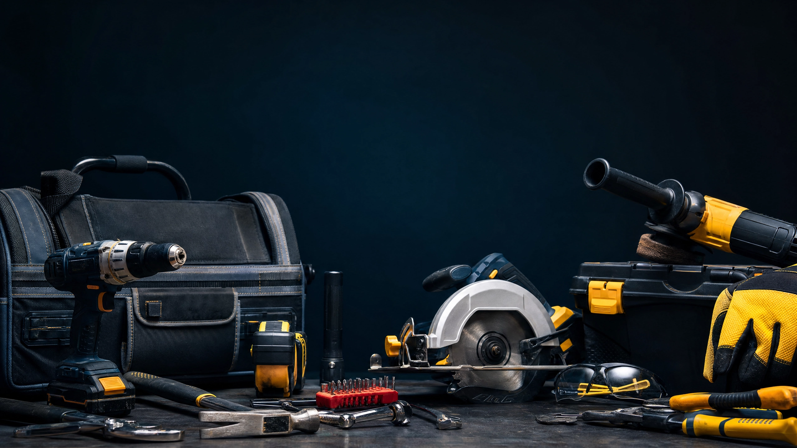 Professional trade tools and equipment on dark surface
