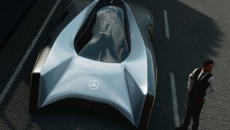 A man in formal attire stands near a futuristic, sleek, silver Mercedes-Benz concept car parked on a road. The vehicle has an aerodynamic design with a prominent Mercedes logo on the rear.