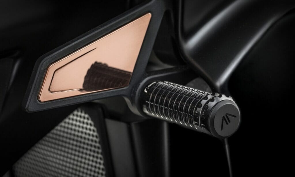 An exclusive black motorcycle with a rose gold handlebar, the Arc Founder's Signature Edition Vector.