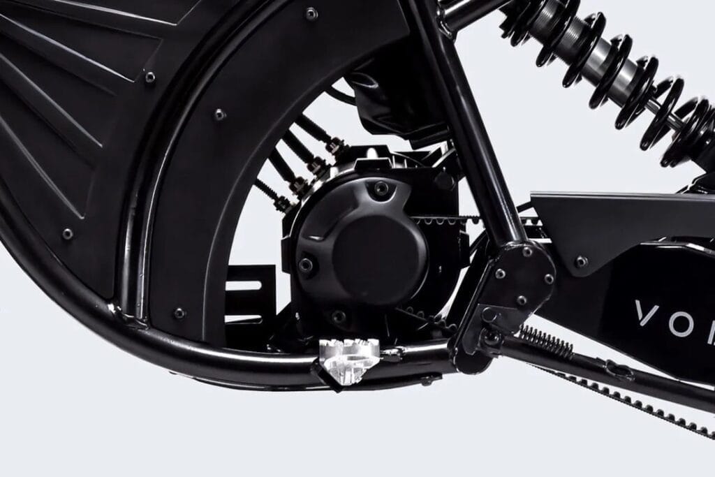 A close up of a black bicycle with a chain on it, featuring Volcon's Grunt EVO.