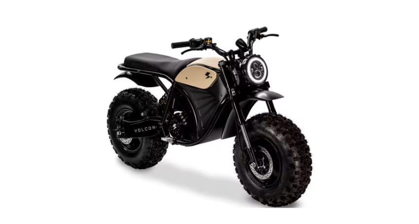 A black and tan motorcycle on a white background.