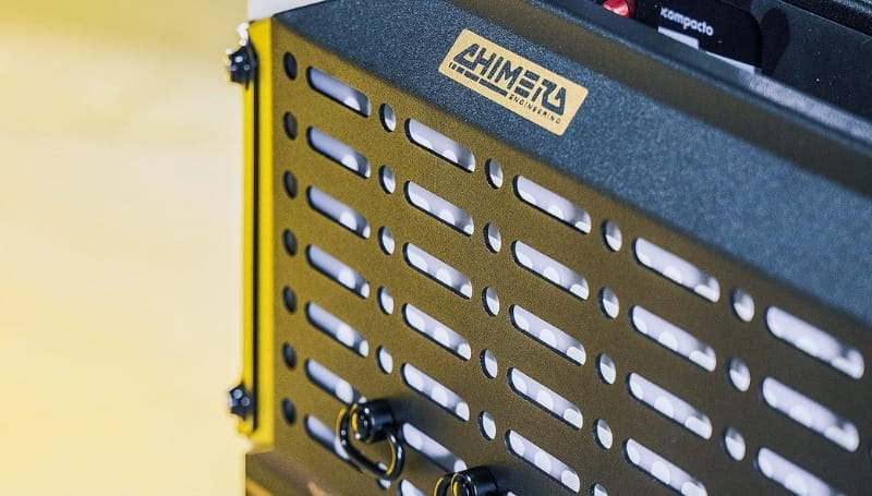 Close-up view of a Chimera sound equipment case, featuring a Moto Distracto logo and ventilation slots.