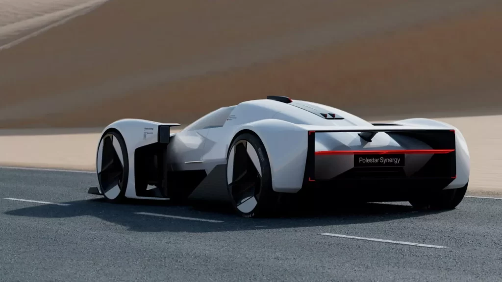 A futuristic auto driving down a desert road.