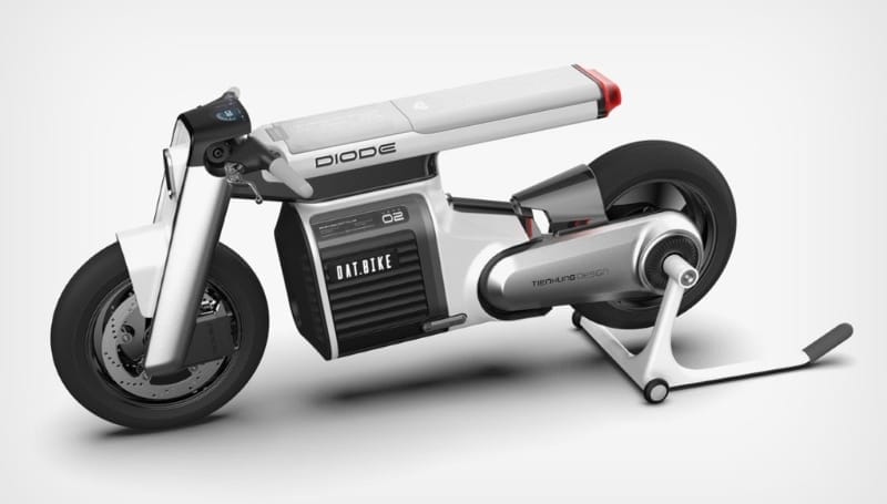 A futuristic, white electric bike named "DIODE" with a sleek design, featuring thick tires, a compact body, and a rear-mounted stand on a white background.