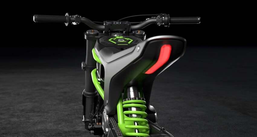 The front end of a green and black dirt bike with modern design.