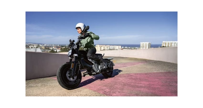 A person is riding a motorcycle on a hill.