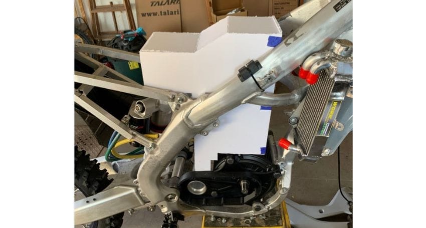 A motorcycle with an attached box, built for electric bike conversions.