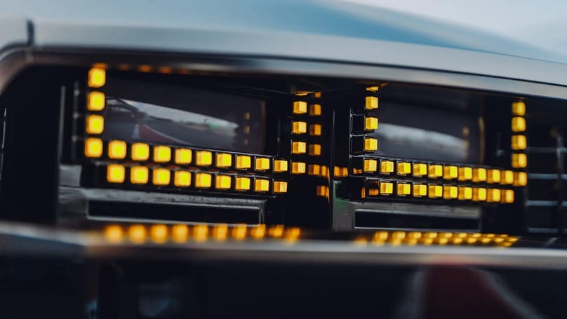 A close up of a car's headlights.