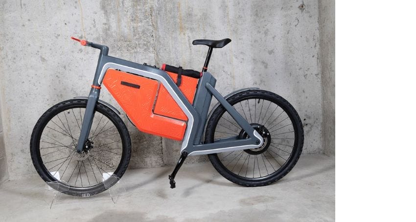 An electric bicycle with a bag attached to it, revolutionizing urban commuting.