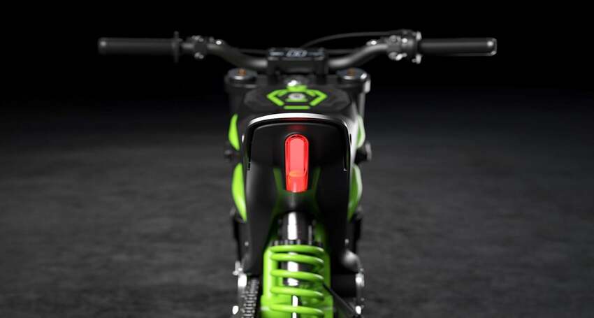 A close up of a classic green and black bike.