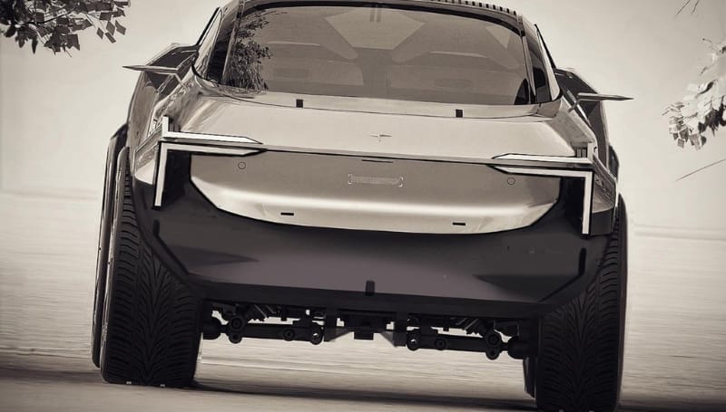 Rear view of a modern car with sleek design and wide tires, displayed in a monochrome filter. The car is on a paved surface with some tree foliage visible near the edges.