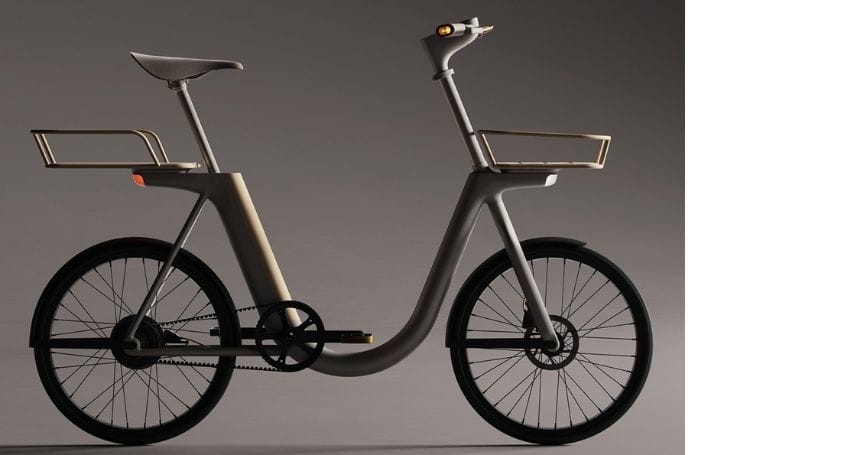 An electric bicycle with a basket on it is shown against a gray background, perfect for urban commuting.