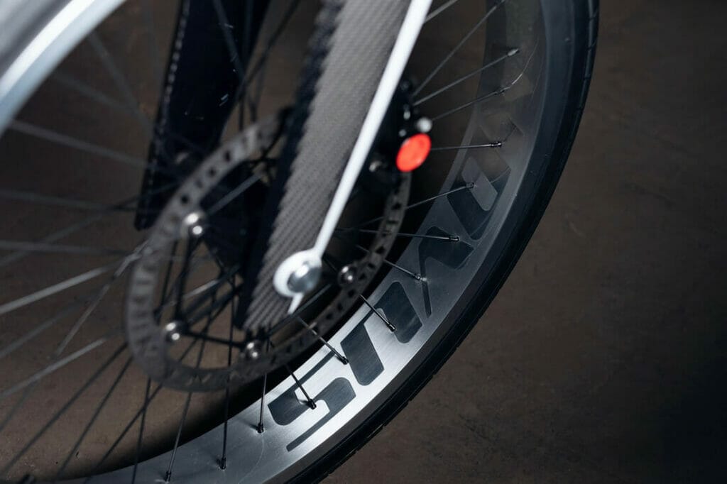 A close up of the wheel of a bicycle.