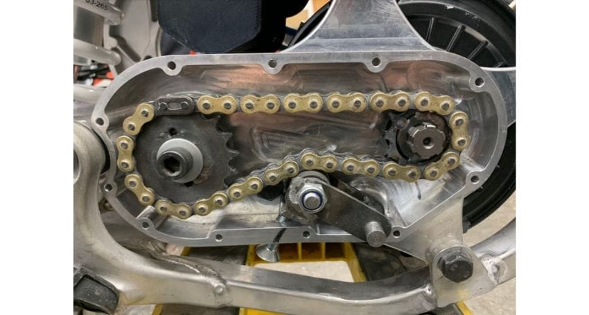 A captivating image showcasing a chain on both a motorcycle and VESC Controllers, highlighting the seamless integration of Electric Bike Conversions into meticulous Builds.