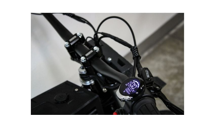 A close up of the handlebars on a bike.