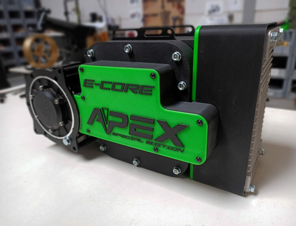 A green and black machine sitting on a table.