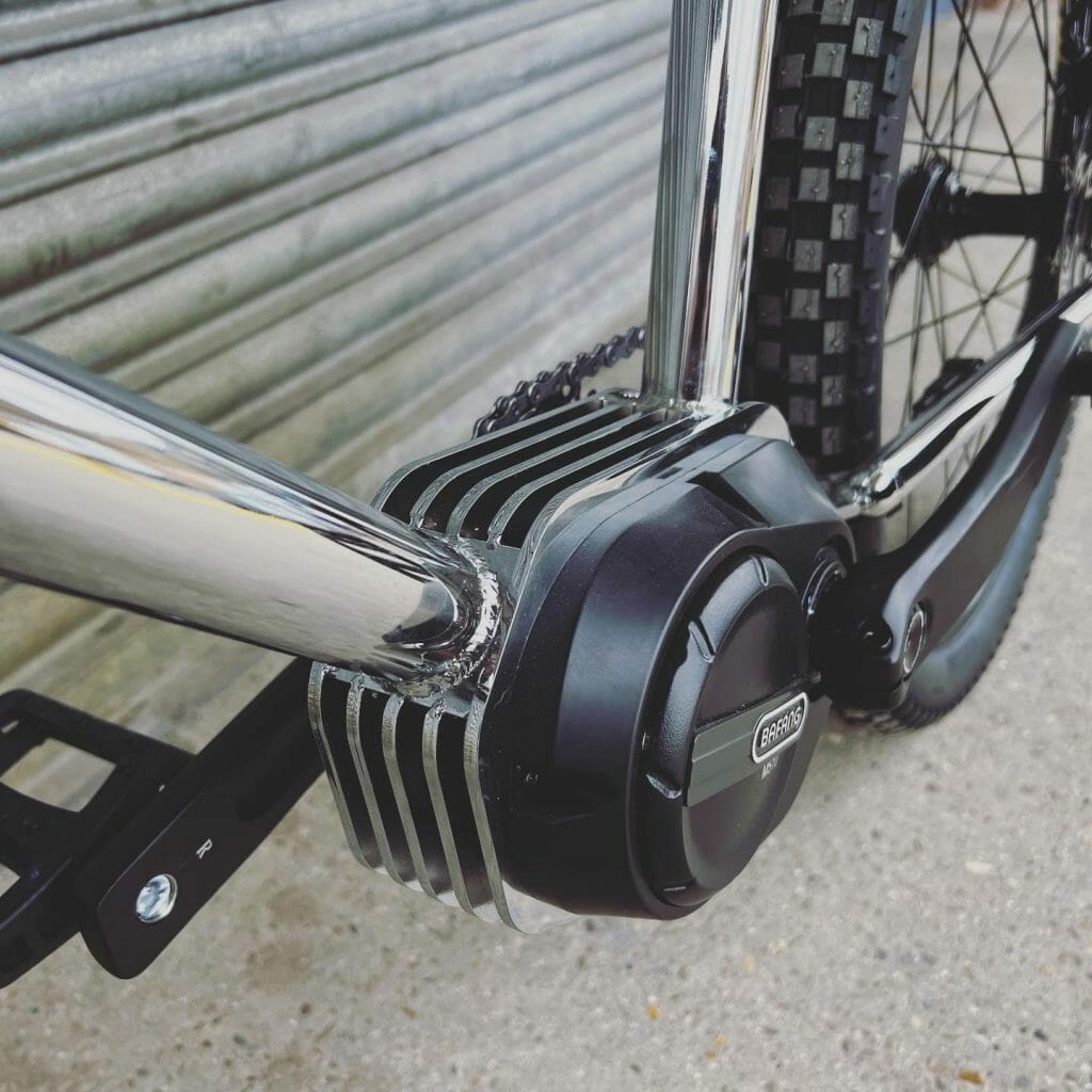 A close up image of a bicycle with a chain drive.