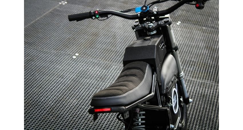 A close up of the seat of an electric bike.