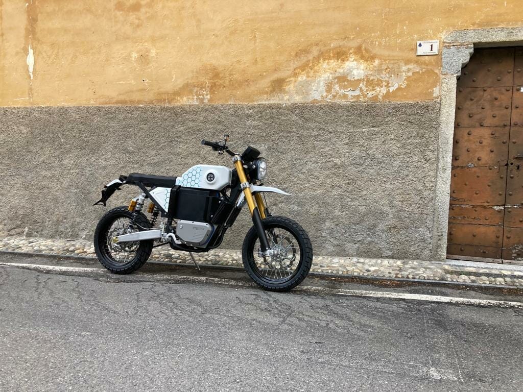 a motorcycle parked on the side of a building