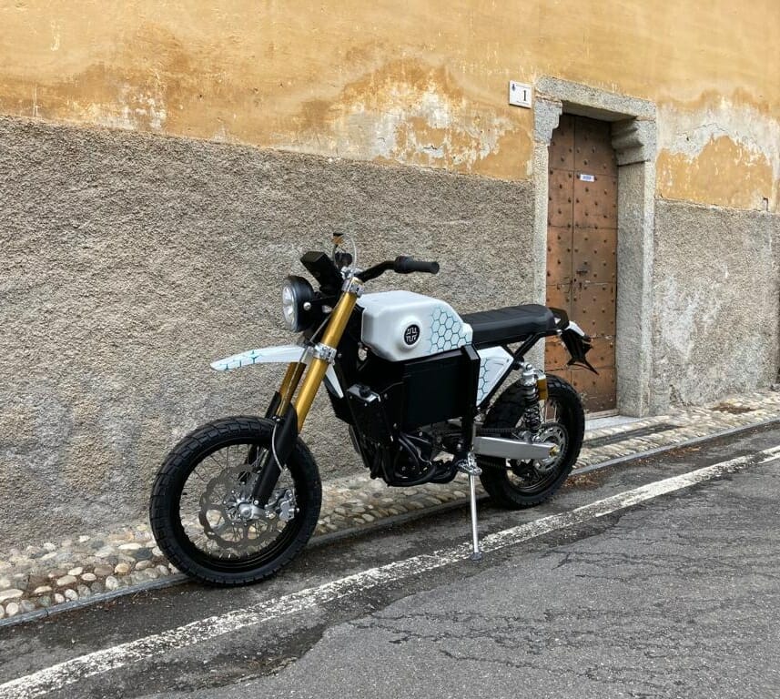 a motorcycle parked on the side of a building
