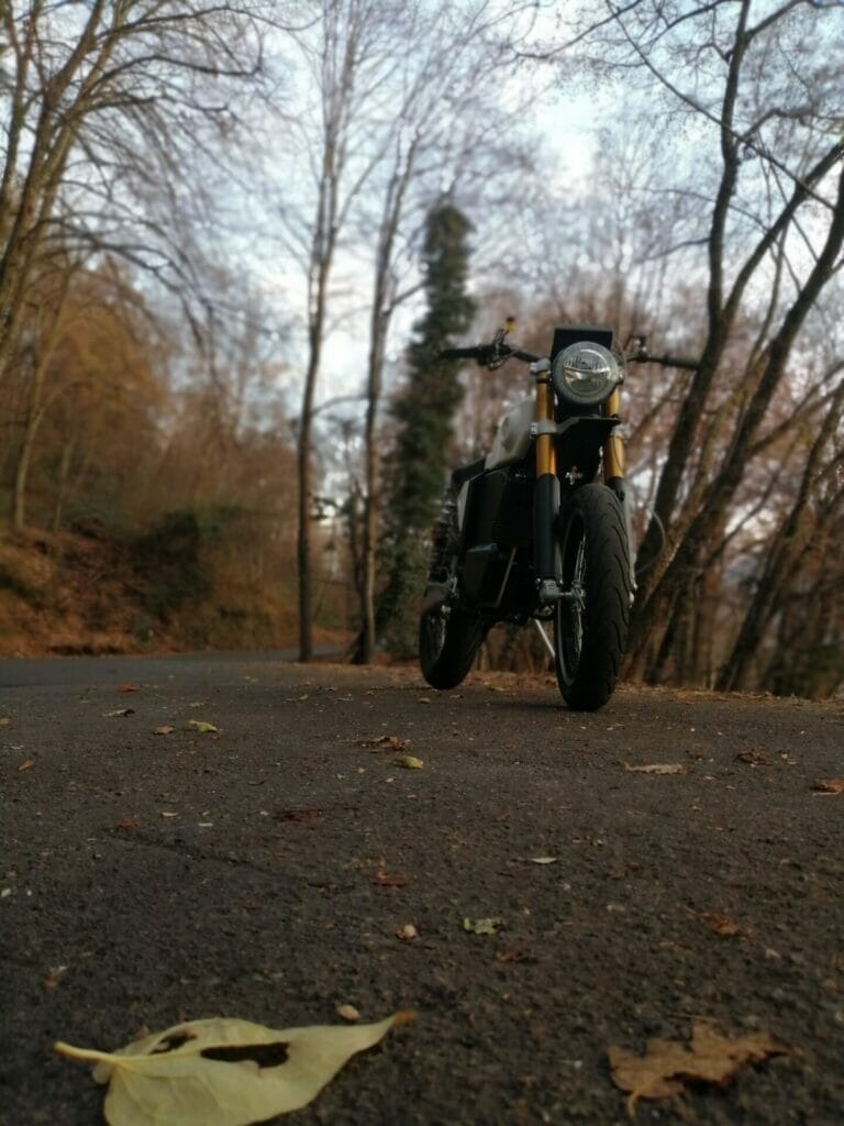 a person riding a bike down a dirt road